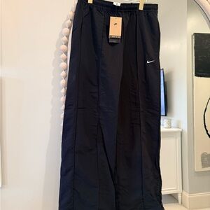 Nike Black Track Pants with White Swoosh Accent